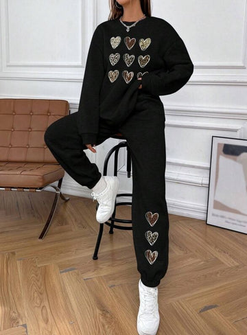 Black, women's hoodie set, long sleeved pants, round neck, with 9 hearts on the chest of the top and 3 heart patterns on the left leg