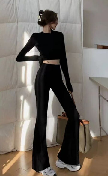 Black, women's casual suit, top with stand up collar and long sleeves, exposed belly button, flared pants