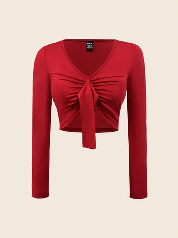 Red, women's top, long sleeved, short cut, V-neck, long fabric strip decoration on the chest