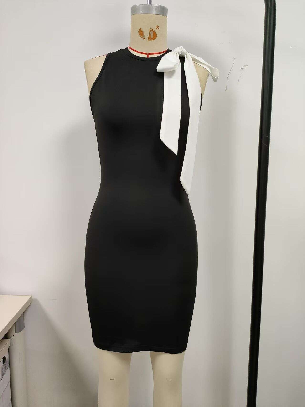 Black, women's dress with bow, tight fit